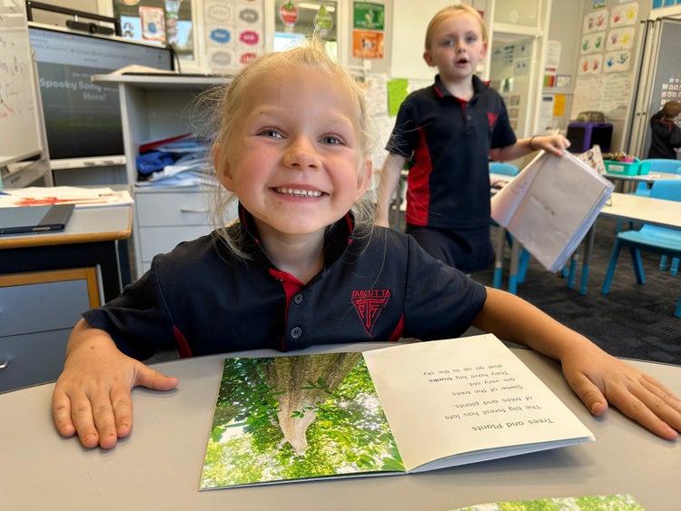A student reading a book.