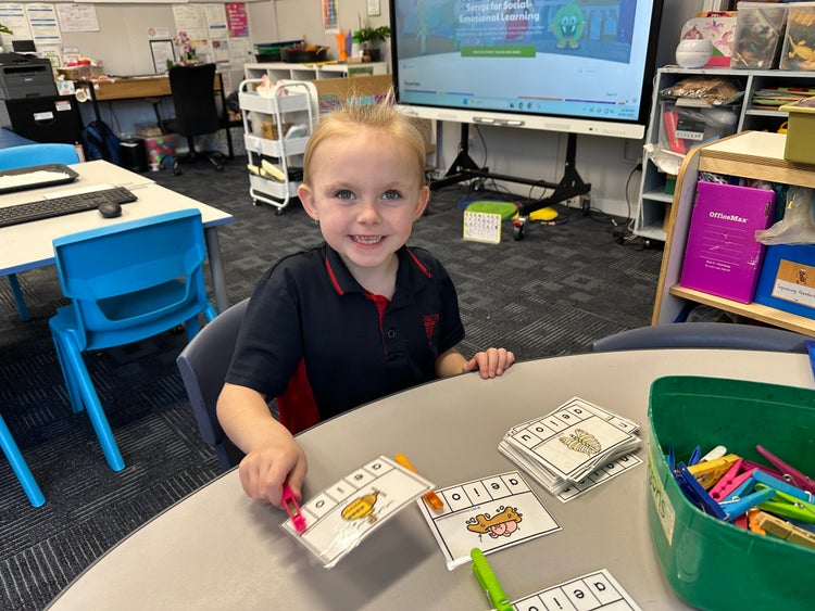 A student learning sounds in the classroom.